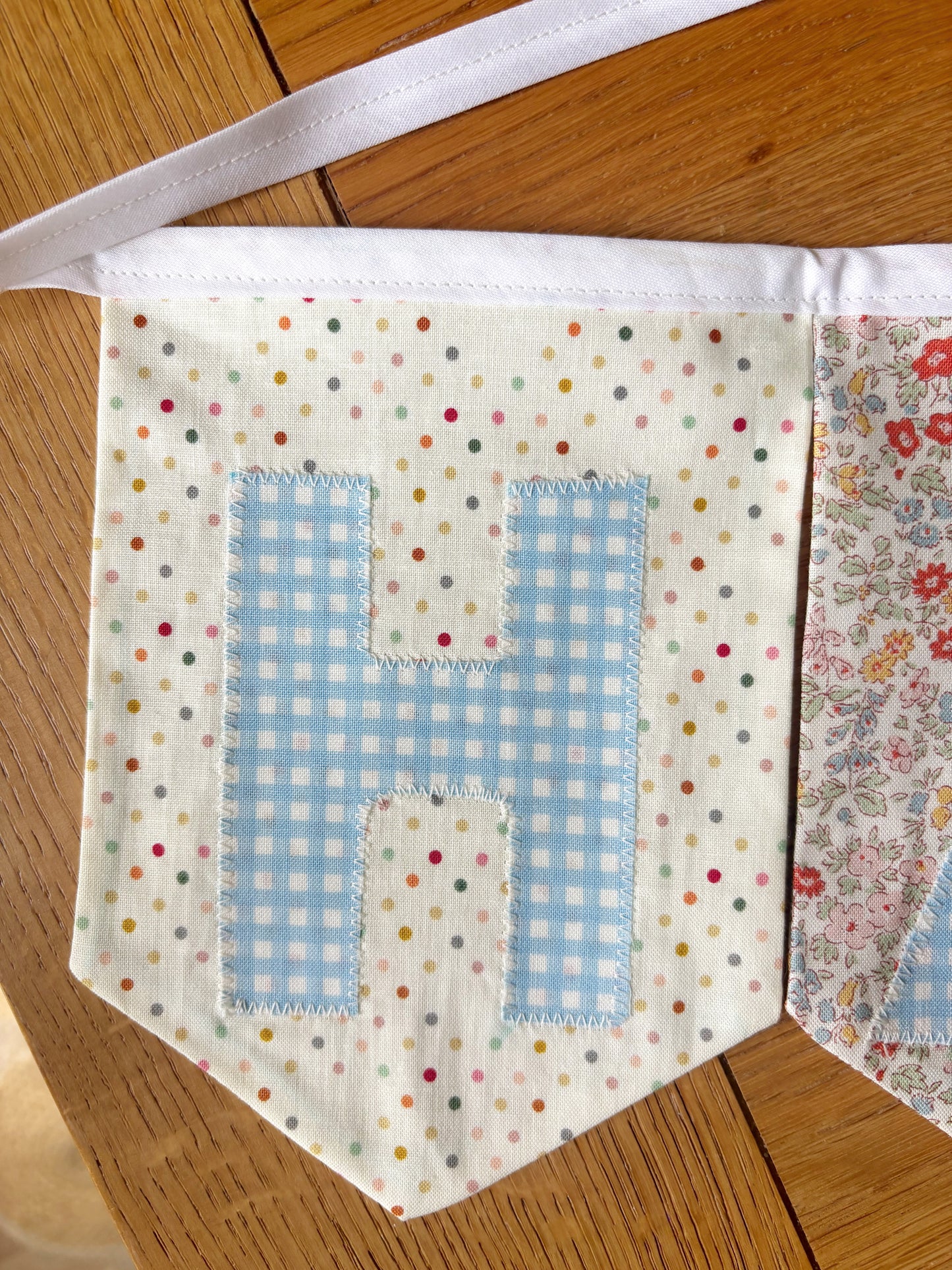 HAPPY BIRTHDAY BANNER - ASSORTED FLAGS W/ BLUE GINGHAM LETTERS